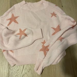 light pink and darker pink sweater with stars